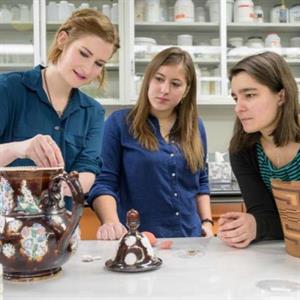Leah Bright, Sam Owens, and Madeline Corona discuss the treatment of a ceramic